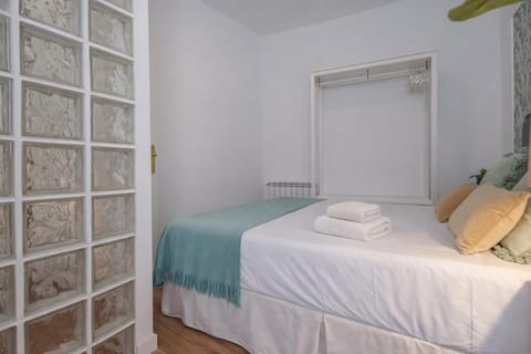 Bed, towels, wardrobe