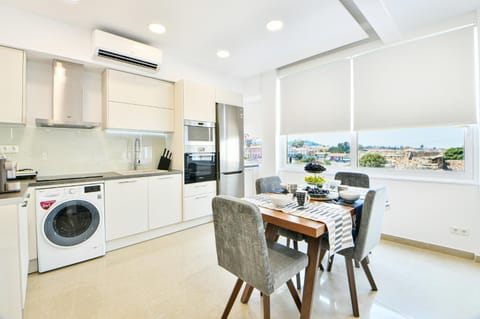 Seating area, Dining area, oven, stove, washing machine, dryer