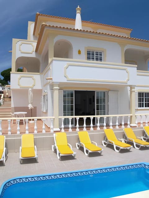 Property building, Living room, Swimming pool