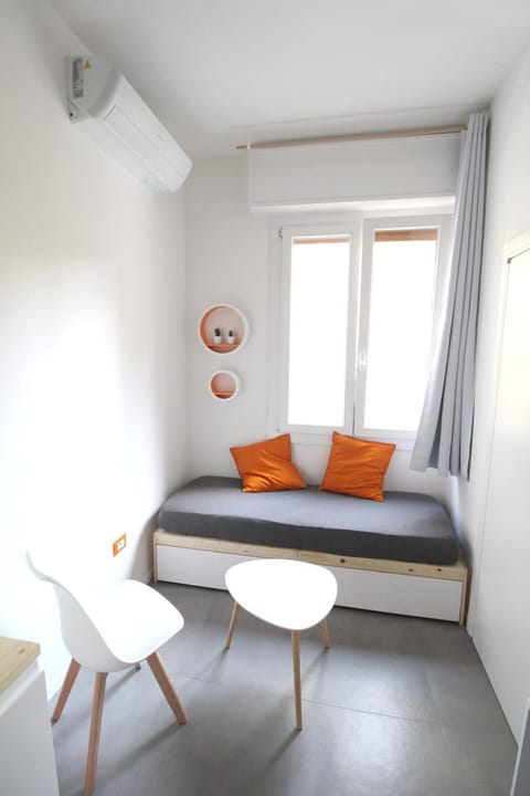 Bed, Living room, Seating area, Dining area