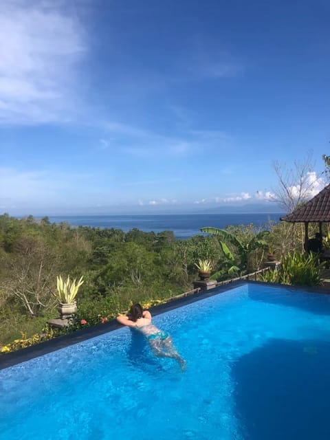Property building, People, View (from property/room), Guests, Sea view, Swimming pool