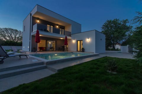 Property building, Patio, Night, Natural landscape, Garden, Garden view, Pool view, Swimming pool, sunbed