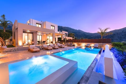 Property building, Patio, Nearby landmark, Night, Natural landscape, Mountain view, Pool view, Swimming pool, sunbed