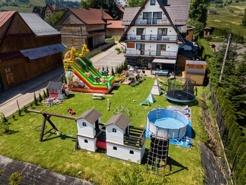 Property building, Day, Natural landscape, Children play ground, Garden, Evening entertainment, Pool view, Swimming pool