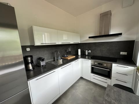 Kitchen or kitchenette, dishwasher, oven, stove, toaster