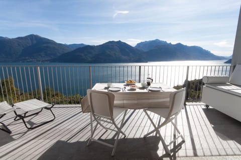 Property building, Balcony/Terrace, Seating area, Lake view, Lake view, Mountain view, Mountain view