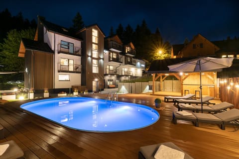 Property building, Patio, Night, Natural landscape, Other, Other, Other, Seating area, Pool view, Swimming pool, Sunset, sunbed, sunbed, towels, towels