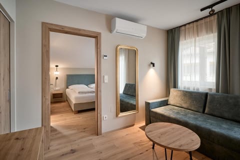 Bed, Living room, Seating area, Bedroom, air conditioner