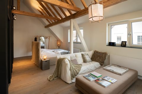 Bed, Living room, Seating area, Bedroom