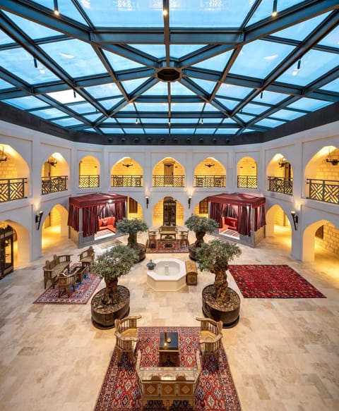 Property building, Communal lounge/ TV room, Lobby or reception, Decorative detail, Seating area, Logo/Certificate/Sign, Logo/Certificate/Sign, On site, furniture, VIP