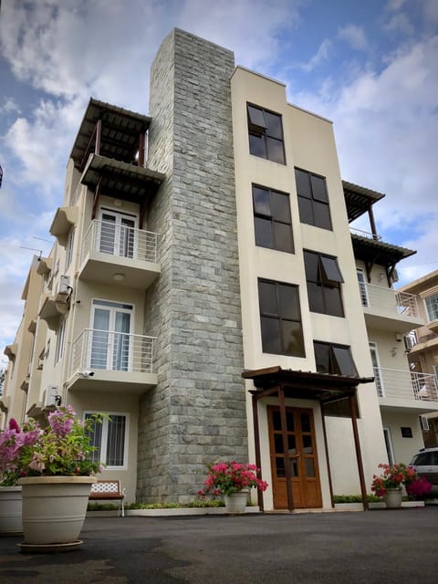 Property building, Facade/entrance, Property logo or sign, Balcony/Terrace, Seating area, Inner courtyard view