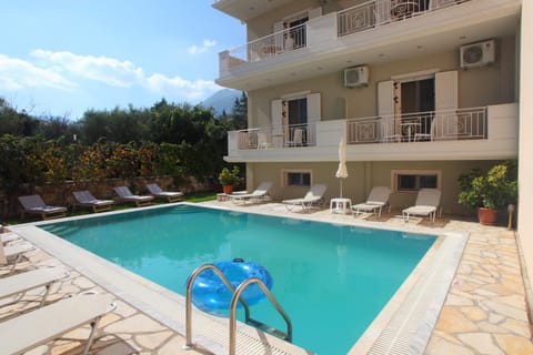 Property building, Pool view, Swimming pool, sunbed
