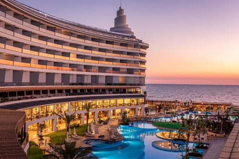 Property building, Natural landscape, Pool view, Sea view, Swimming pool, Sunset, sunbed