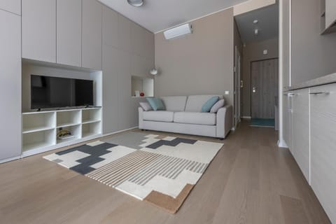 Bed, TV and multimedia, Living room, Seating area, wardrobe, air conditioner