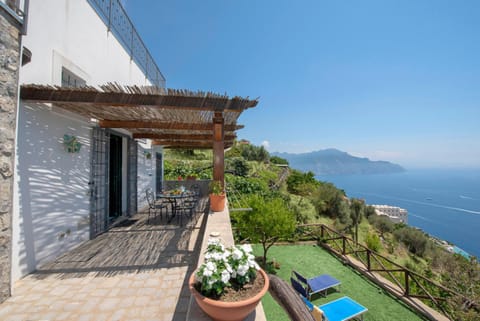 Property building, Patio, Natural landscape, Balcony/Terrace, Mountain view, Pool view, Sea view, sunbed