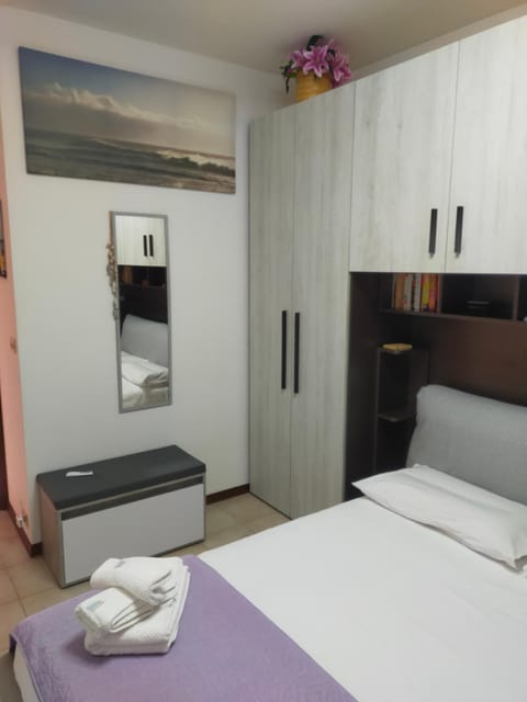 Bedroom, microwave, towels, wardrobe