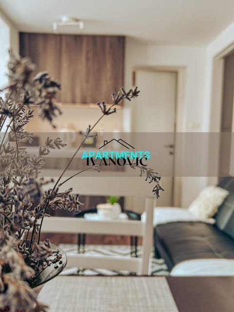 Property logo or sign, Living room, Seating area, Text overlay, Internal: Not applicable to any particular room