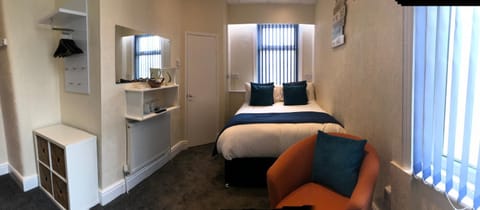 Shower, Bed, Seating area, Bedroom