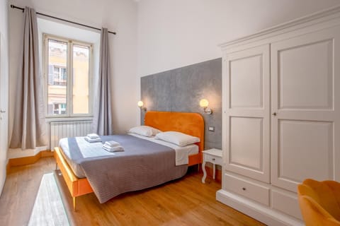 Bed, towels, wardrobe