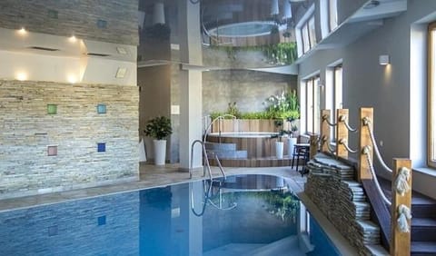 Hot Tub, Sauna, Swimming pool, Parking, hair dryier, sunbed, towels