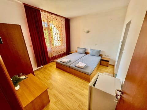 Bed, towels, wardrobe