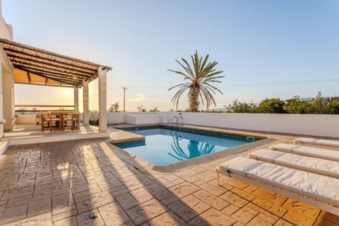 Patio, Day, Natural landscape, Pool view, Swimming pool, sunbed