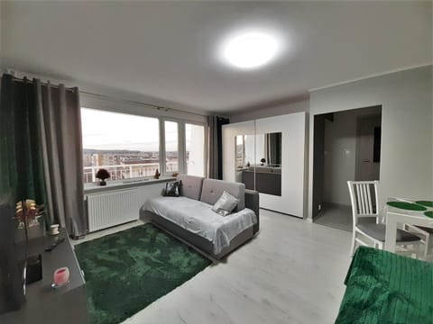 Bed, TV and multimedia, Living room, Seating area, Bedroom