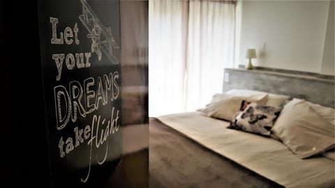 Bed, Property logo or sign, Bedroom