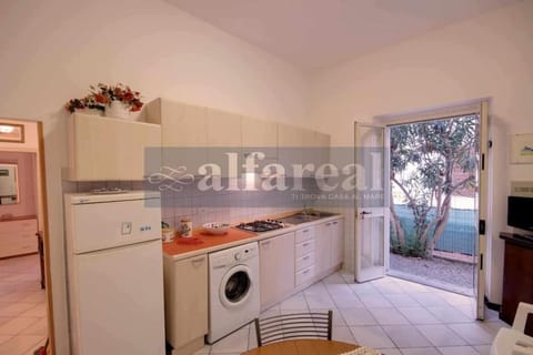 Kitchen or kitchenette, stove, washing machine