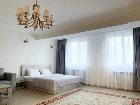 Communal lounge/ TV room, Bed, Living room, Seating area, Bedroom