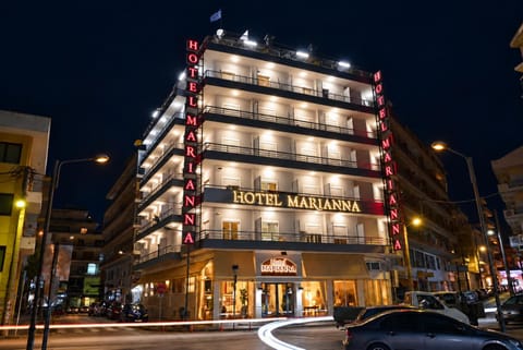 Property building, Facade/entrance, Night, Property logo or sign, Property logo or sign, Neighbourhood, Balcony/Terrace, Text overlay, City view, Street view, Area and facilities, Location, Certificate/Award, Parking