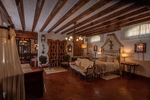 Bed, Living room, Seating area, Bedroom
