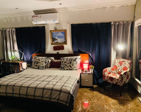 Bed, Living room, Seating area, Bedroom, air conditioner