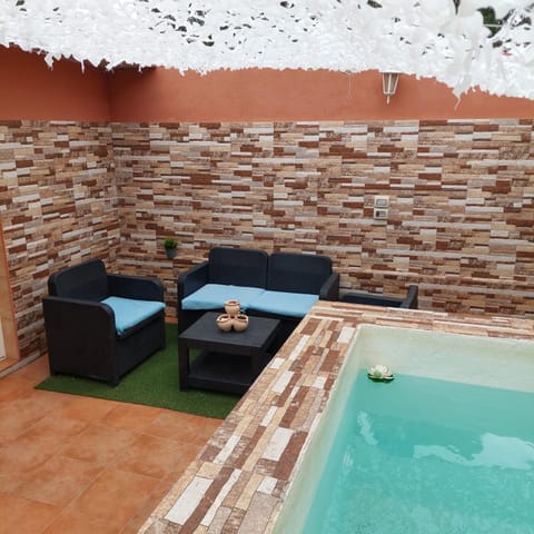 Patio, Day, Natural landscape, Seating area, Pool view, Swimming pool, sunbed