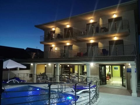 Property building, Night, View (from property/room), Balcony/Terrace, Pool view, Swimming pool, sunbed