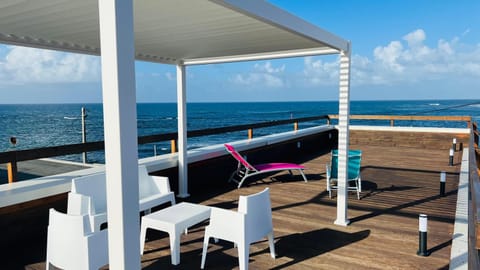 Property building, Patio, Natural landscape, View (from property/room), Balcony/Terrace, Sea view, sunbed