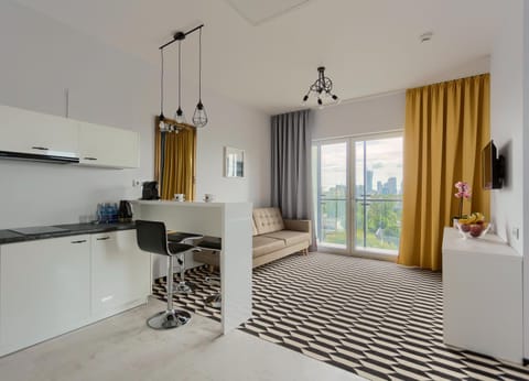 Kitchen or kitchenette, Living room, Seating area, Dining area
