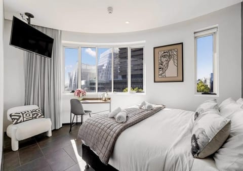 Bed, Bedroom, City view, hair dryier, stove, towels, washing machine, dryer, air conditioner