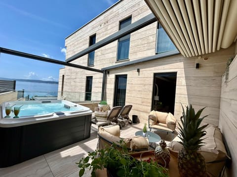 Property building, Day, BBQ facilities, Hot Tub, View (from property/room), Balcony/Terrace, Seating area, Sea view, sunbed