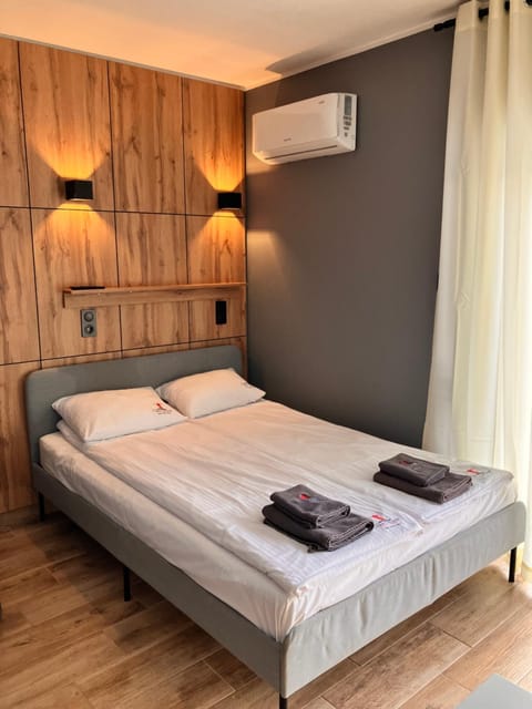 Bed, Photo of the whole room, Bedroom, towels, air conditioner