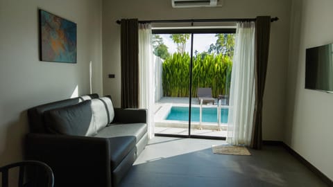 Living room, Seating area, Pool view