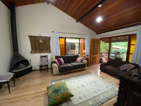 Communal lounge/ TV room, Activities, Living room, Decorative detail, Seating area, Floor plan, Garden view, Mountain view, Family