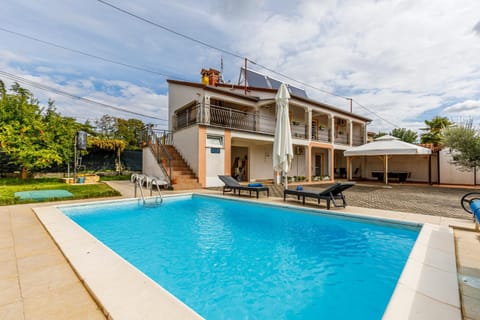 Property building, Patio, Swimming pool, sunbed