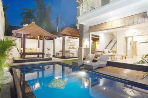 Property building, Patio, Night, Living room, Seating area, Pool view, Swimming pool, sunbed