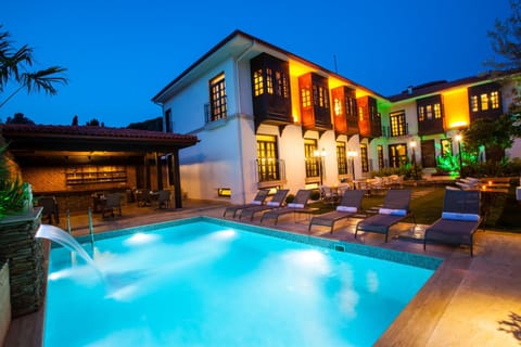 Property building, Night, Natural landscape, Pool view, Swimming pool, sunbed