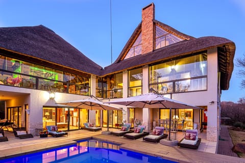 Property building, Day, Natural landscape, Garden, Seating area, Pool view, Swimming pool, sunbed