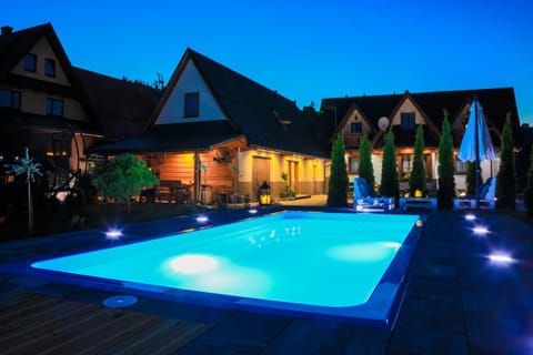 Property building, Night, Pool view, Swimming pool, sunbed