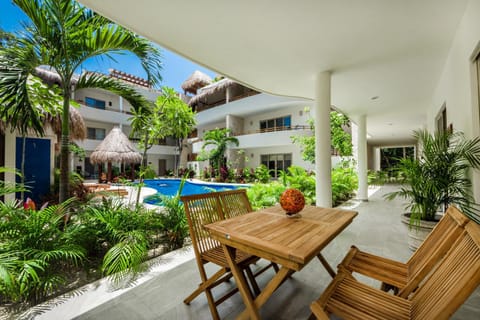 Property building, Patio, Natural landscape, Balcony/Terrace, Balcony/Terrace, Seating area, Dining area, Pool view, Swimming pool