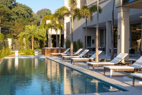 Property building, Natural landscape, Pool view, Swimming pool, sunbed