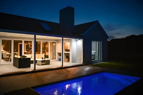 Property building, Patio, Night, Pool view, Swimming pool